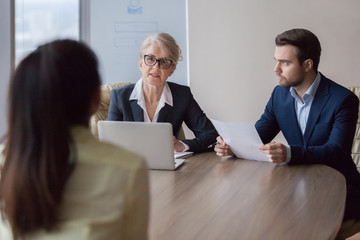 Businesswoman and businessman HR manager interviewing woman. Candidate female for company position...