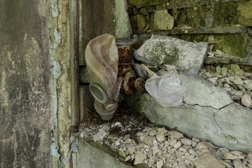 Derelict internal area of a building w gas mask (Pripyat/Chernobyl) 