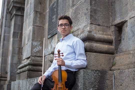 portrait of violinist in castle