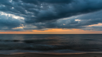 the clouds covers the sea in the evening