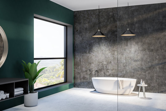 Green and concrete bathroom, round tub and sink
