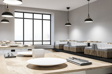 Laid table in white sofa cafe interior