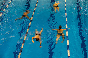 Indoor swimming pool in sport club. Swimming training. Healthy lifestyle concept.