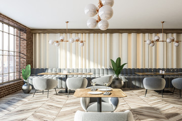 Brick wall gray sofas and armchairs coffee shop