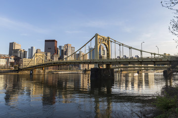 Fototapeta na wymiar Urban waterfront and bridges crossing the Allegheny River in downtown Pittsburgh, Pennsylvania.