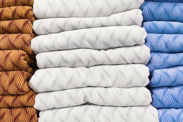 Warm clothing on shelves in the store
