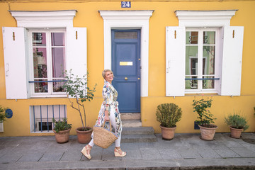 woman in front of a house