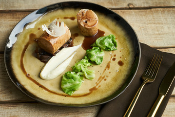 Duck breast galantine, mushroom fricassee, young cabbage and sauce. chicken sausage with baked green cabbage. Healthy diet food concept.