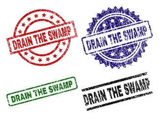DRAIN THE SWAMP seal prints with distress style. Black, green,red,blue vector rubber prints of DRAIN THE SWAMP caption with grunge style. Rubber seals with round, rectangle, medal shapes.