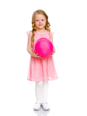 little girl is engaged in fitness with a ball.