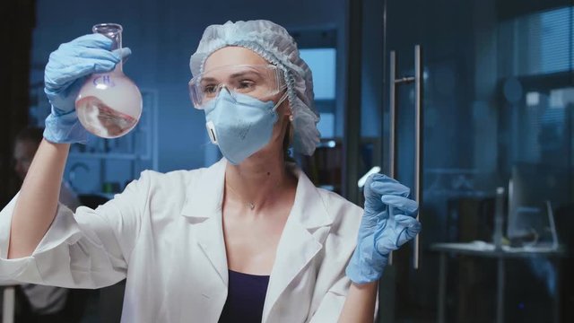Woman worker studying chemical compound of methyl
