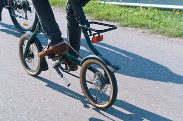 Fototapeta premium Bike with small wheels. Delt drive on the bike. Bike rides on the road.