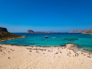 Fototapeta na wymiar Aerial view to the beautiful bay and peninsula of Gramvousa and Balos lagoon. Amazing wallpaper, photo from drone. Crete, Greece.