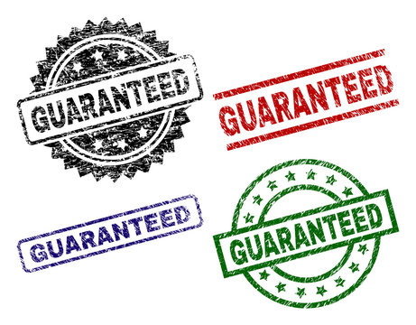 GUARANTEED seal stamps with damaged texture. Black, green,red,blue vector rubber prints of GUARANTEED caption with retro texture. Rubber seals with round, rectangle, medallion shapes.