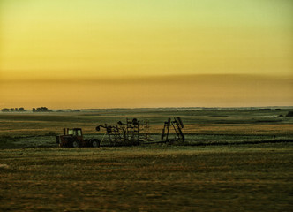 Saskatechewan fields and machinery in the sunrise