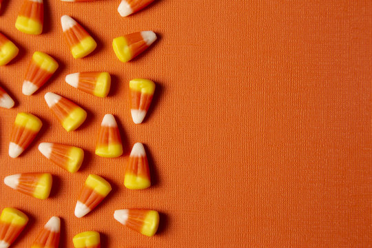 Halloween Candy Background on an Orange Surface