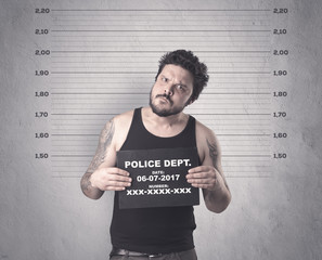 Caught gangster in jail with table on his hand.