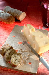 cheese bread board knife glass with water