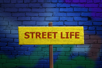 Fototapeta premium Street Life sign on graffiti wall background