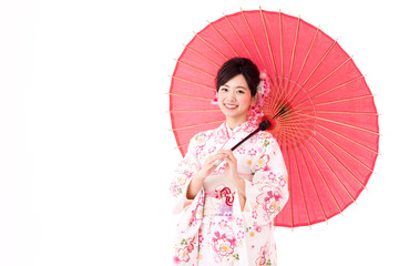 portrait of young asian woman wearing pink kimono on white background