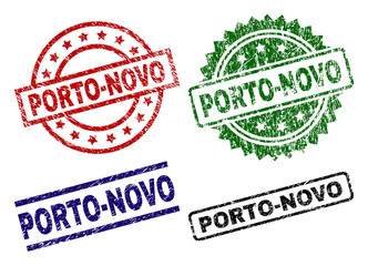 PORTO-NOVO seal prints with distress surface. Black, green,red,blue vector rubber prints of PORTO-NOVO label with scratched surface. Rubber seals with circle, rectangle, medal shapes.