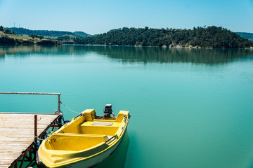 Moored yellow boat. Green Canyon, Manavgat. Rest in Side, Turkey. Pier on the Green Canyon.Travel in warm countries. Boat trip