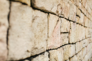 Closeup texture of brick aged wall in sand color outdoor