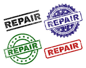 REPAIR seal prints with damaged texture. Black, green,red,blue vector rubber prints of REPAIR caption with corroded texture. Rubber seals with circle, rectangle, rosette shapes.