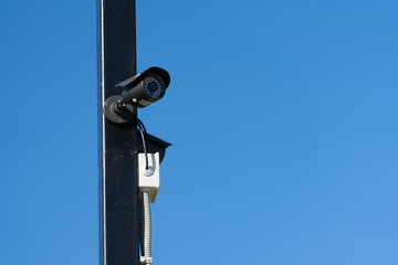 Fototapeta na wymiar Security cameras on the pole. Place for your text.
