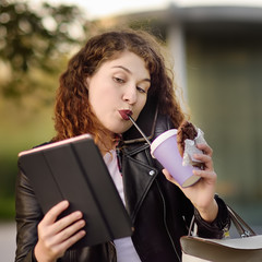 Portrait of young busy woman in the big city