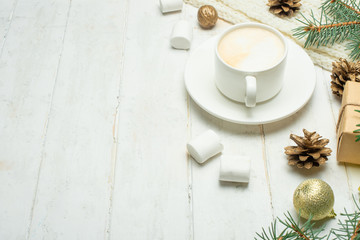 Christmas composition in Scandinavian style. Christmas gifts, coffee with marshmallows, pine cones, spruce branches on a wooden white background. Flat lay. view from above, place to copy. Banner