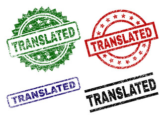 TRANSLATED seal prints with damaged surface. Black, green,red,blue vector rubber prints of TRANSLATED tag with dirty surface. Rubber seals with round, rectangle, rosette shapes.