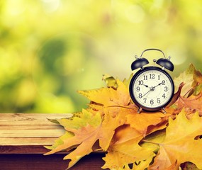 Retro alarm clock on table  background