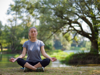 Fototapeta premium woman meditating and doing yoga exercise