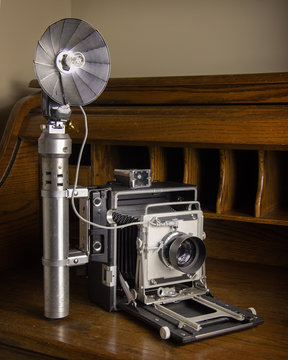 Vintage press camera and flash Stock Photo | Adobe Stock