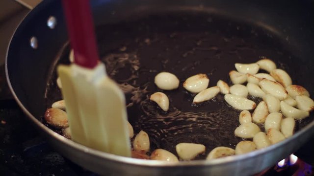 Frying garlic in a pan