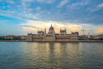 Fototapeta na wymiar Sunset view of Budapest Parliament Building with view of Danube River in Hungary