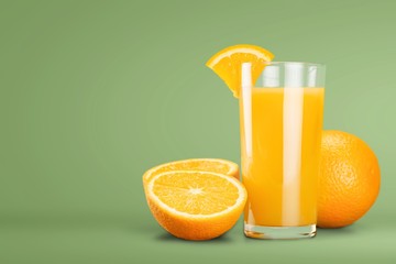Glass of delicious orange juice on natural