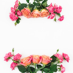 Floral frame made of roses flowers on white background. Flat lay, top view.