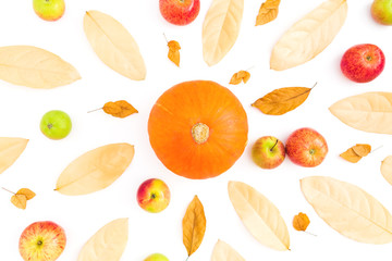 Autumn background with dried leaves, apples and pumpkin on white background. Flat lay, top view