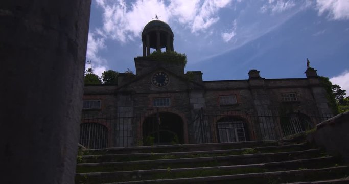 Classical bell tower building and arch stairway steps sunshine