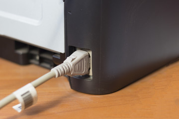 connection of the printer with wires from the computer and the network