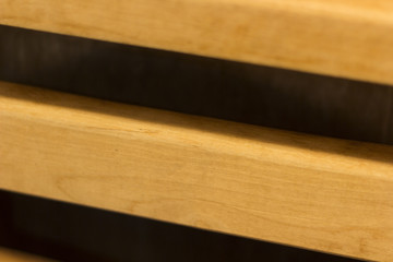 The wooden wall of yellow color is made of profile strip