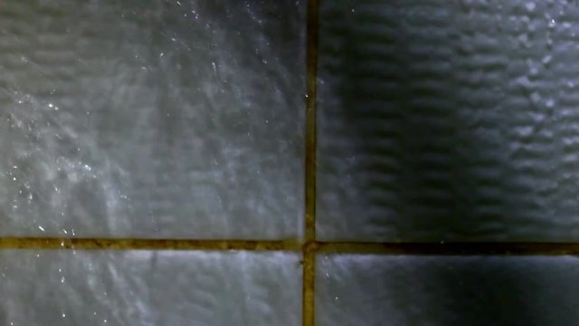 Ceramic wall or floor with drops ow water, cleaning service framed background