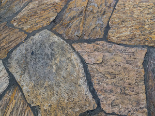 Background of granite stone wall pattern texture.