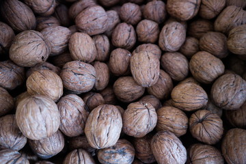 Background of walnuts Fresh walnuts. Walnut background scattered pile of walnuts