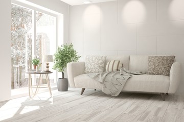 White room with sofa and winter landscape in window. Scandinavian interior design. 3D illustration