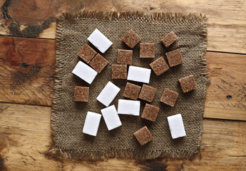 aerial view of group of sugar cubes on wooden background
