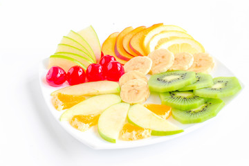 tray of cut fruits on white background