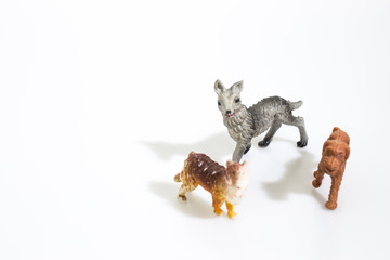 Christmas objects, plastic animals dogs for nativity diorama isolated in a white background